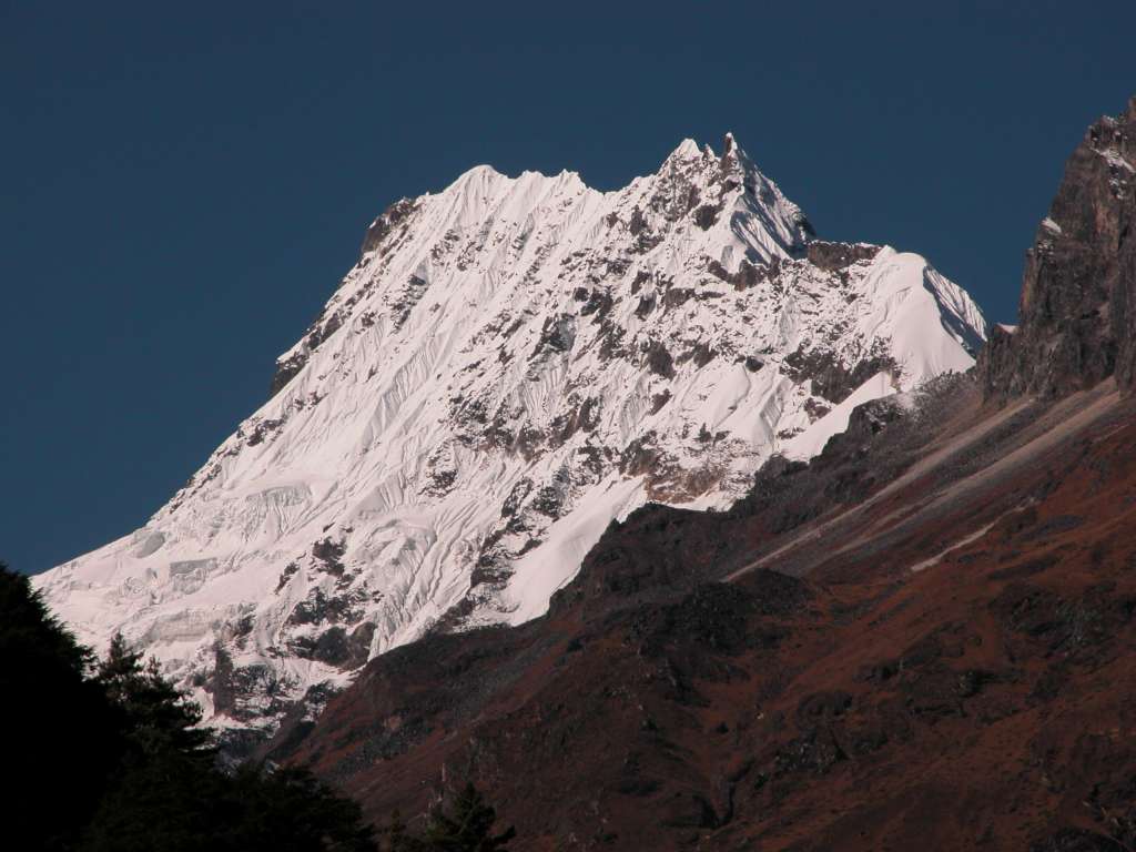 Manaslu 06 03 Simnang Himal From Lihi From Lihi I could see Simnang Himal (6251m), a steep snow-covered mountain with a jagged summit. It reminded me of the Matterhorn north face.